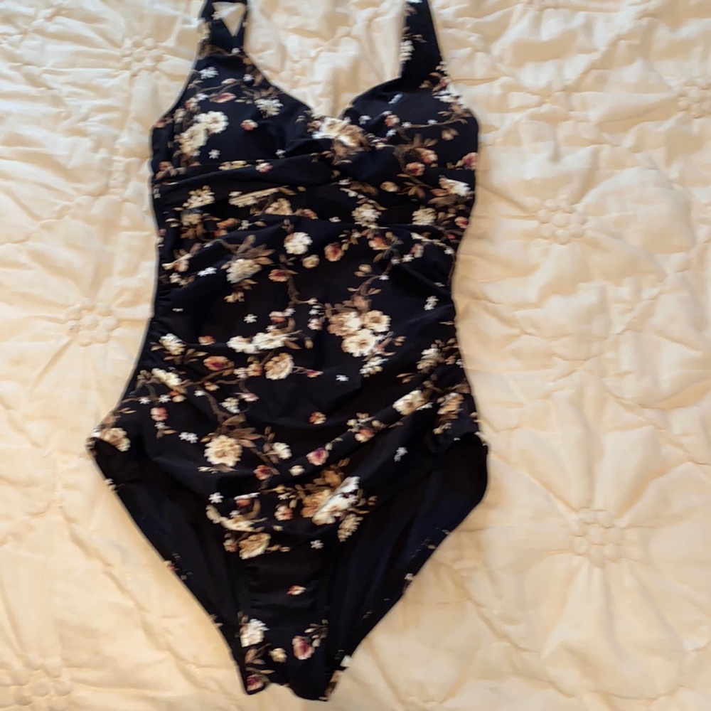 Whole piece bathing suit with sewed in lining
